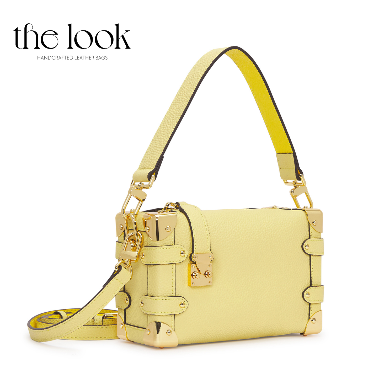 Yellow handbag with gold accents on a white background, branded 'the look'. | The Look Officiel