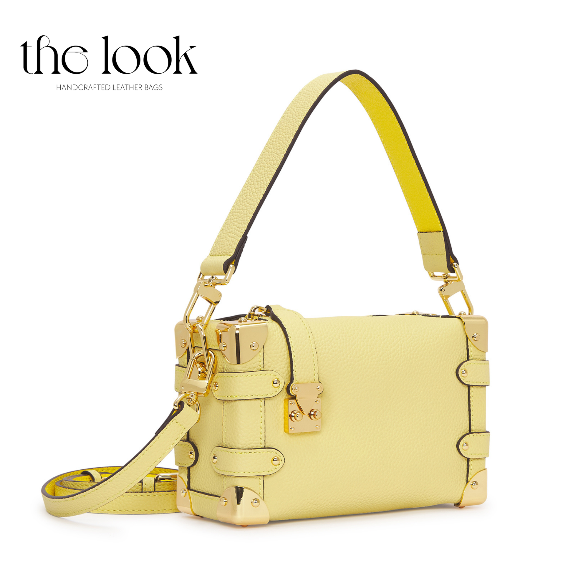 Yellow handbag with gold accents on a white background, branded 'the look'. | The Look Officiel