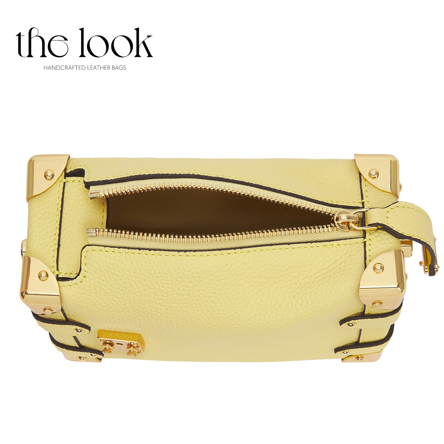 Yellow leather bag with gold accents on a white background, featuring 'the look' brand. | The Look Officiel