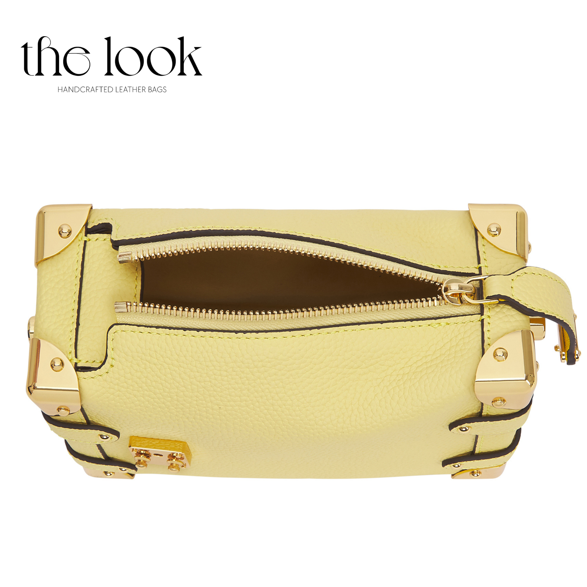 Yellow leather bag with gold accents on a white background, featuring 'the look' brand. | The Look Officiel