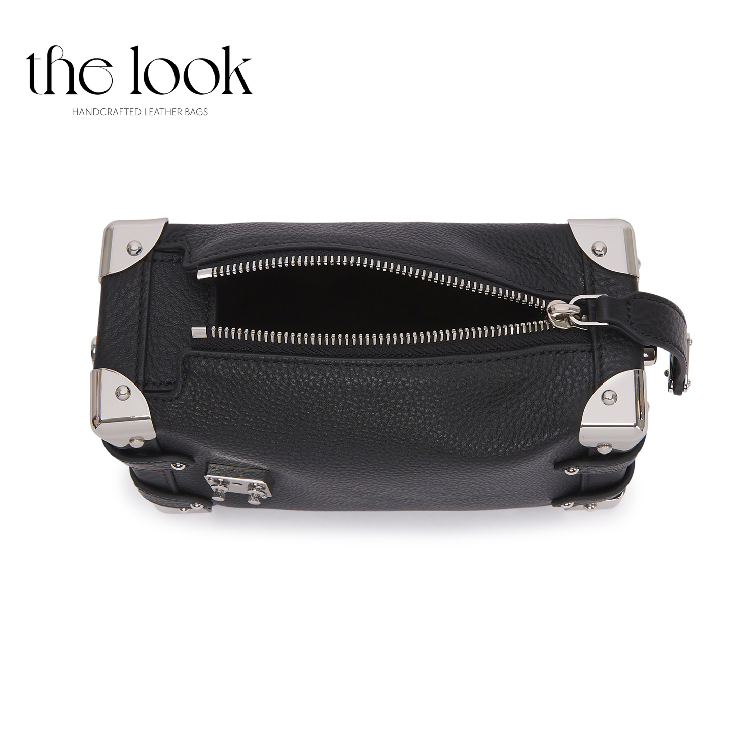 Black leather bag with silver zippers and accents on a white background, branded 'the look'. | The Look Officiel