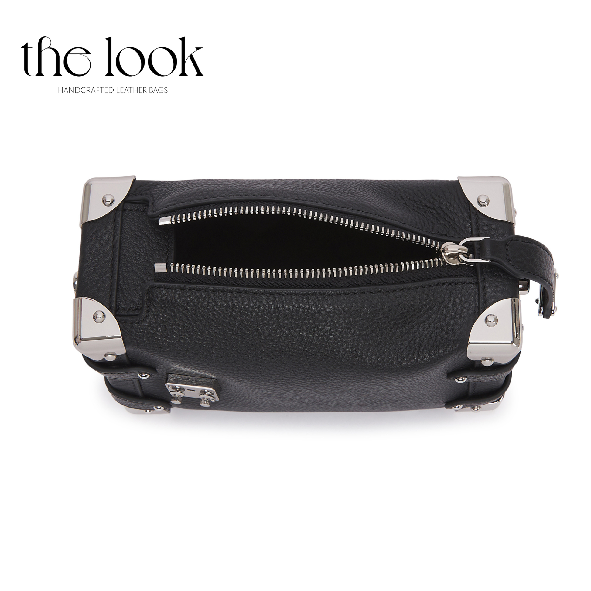 Black leather bag with silver zippers and accents on a white background, branded 'the look'. | The Look Officiel