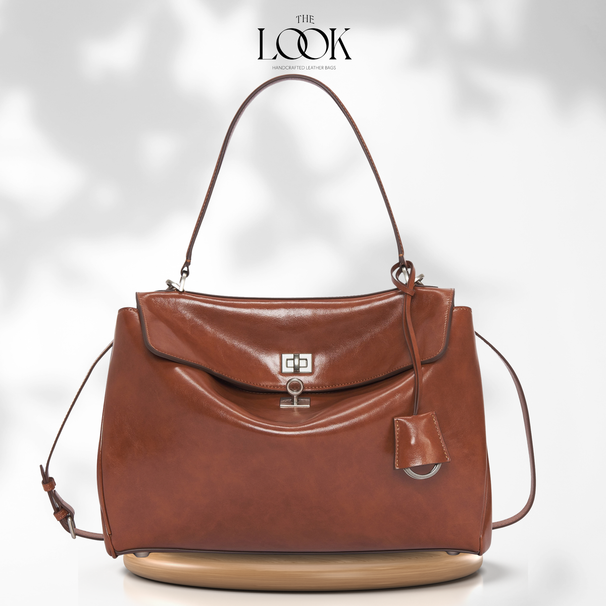 Valen Jumbo Satchel in Caramel, front product view on wooden platform | The Look Officiel
