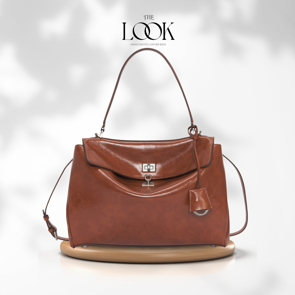 Valen Large Satchel in Caramel, front product view on wooden platform | The Look Officiel