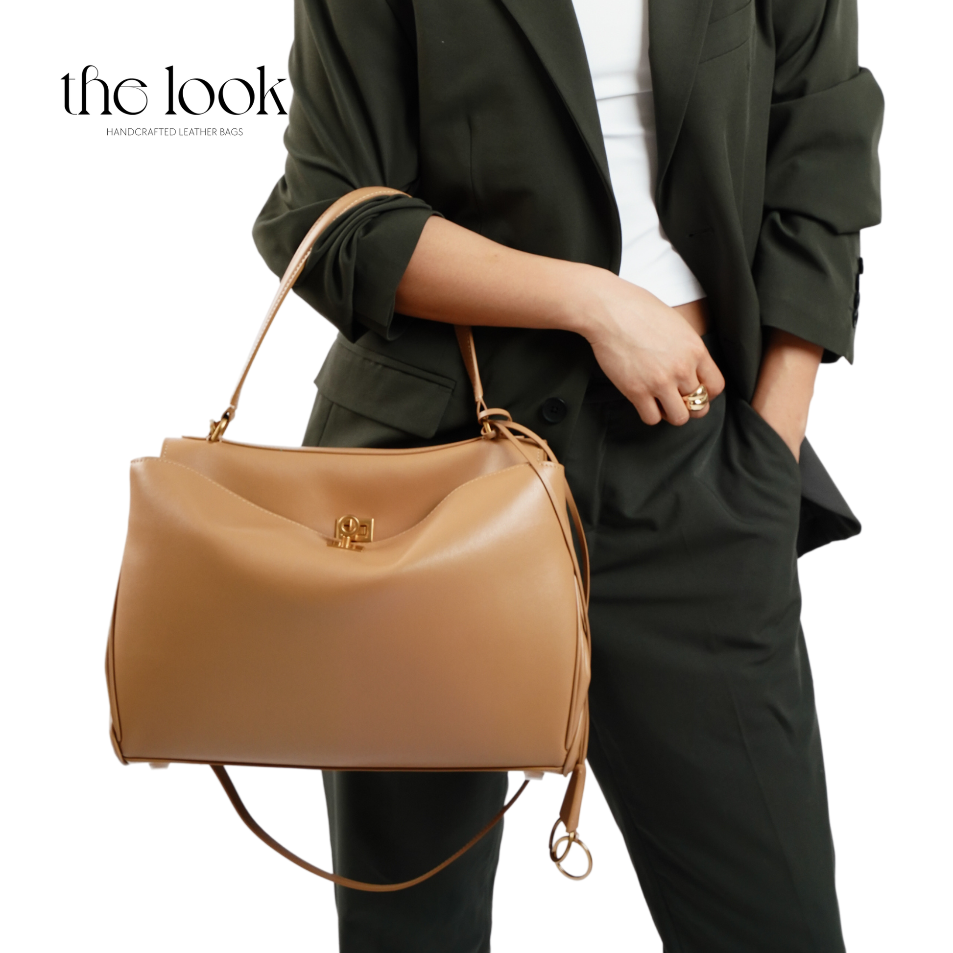 The Valen Large Satchel — genuine leather handbag, held | The Look Officiel