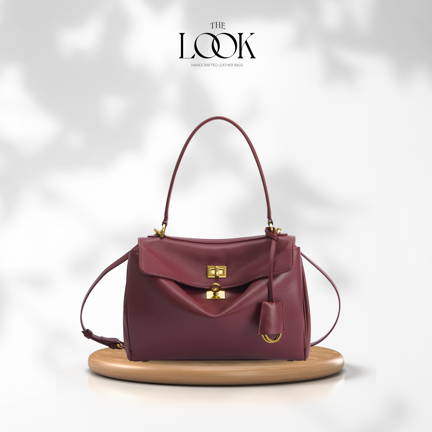 The Valen Medium Satchel — genuine leather handbag, front detail | The Look Officiel