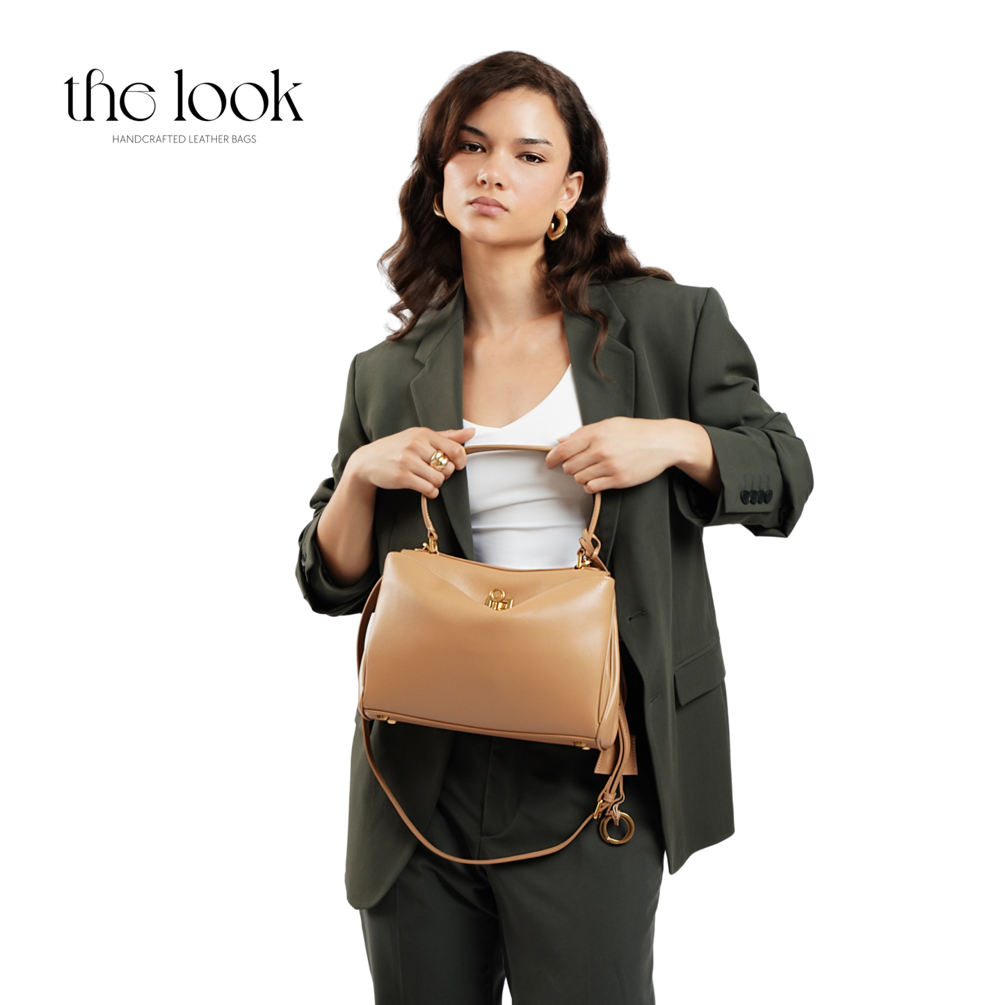 The Valen Medium Satchel — genuine leather handbag, held | The Look Officiel