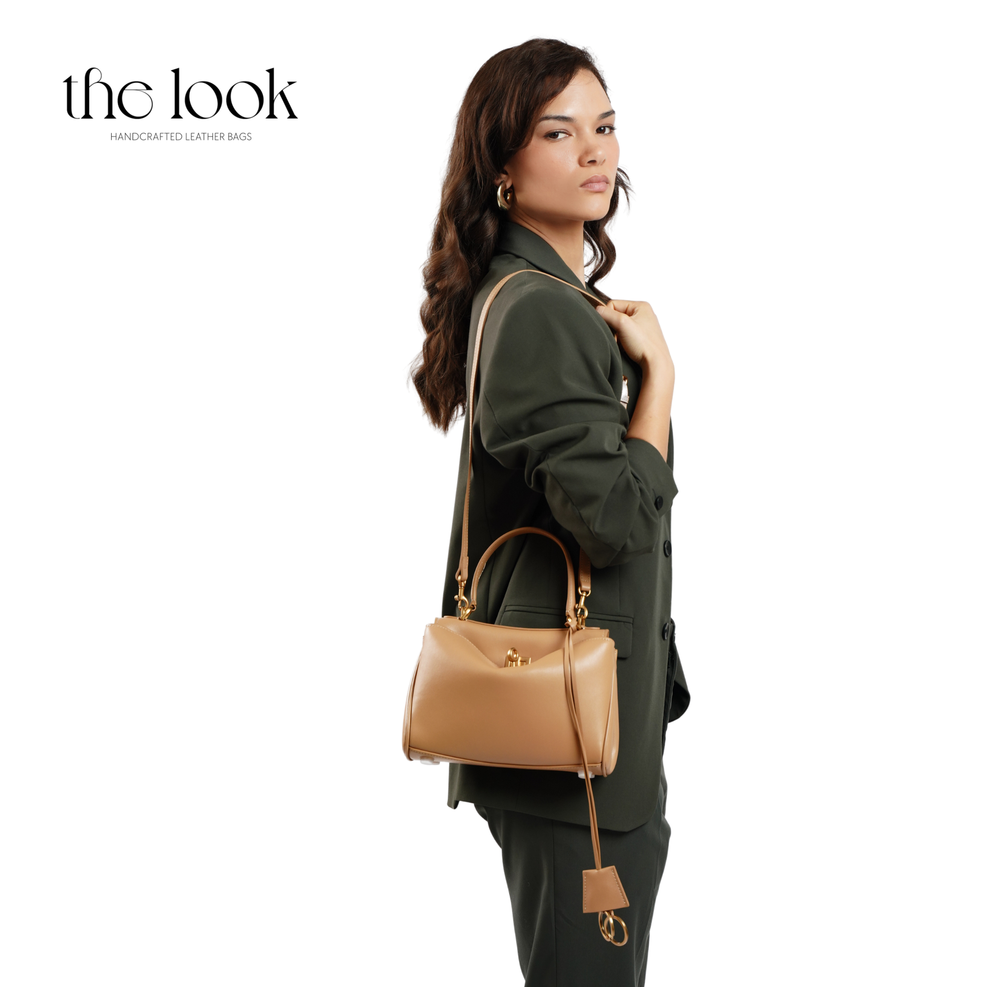 The Valen Small Satchel — genuine leather handbag, held | The Look Officiel