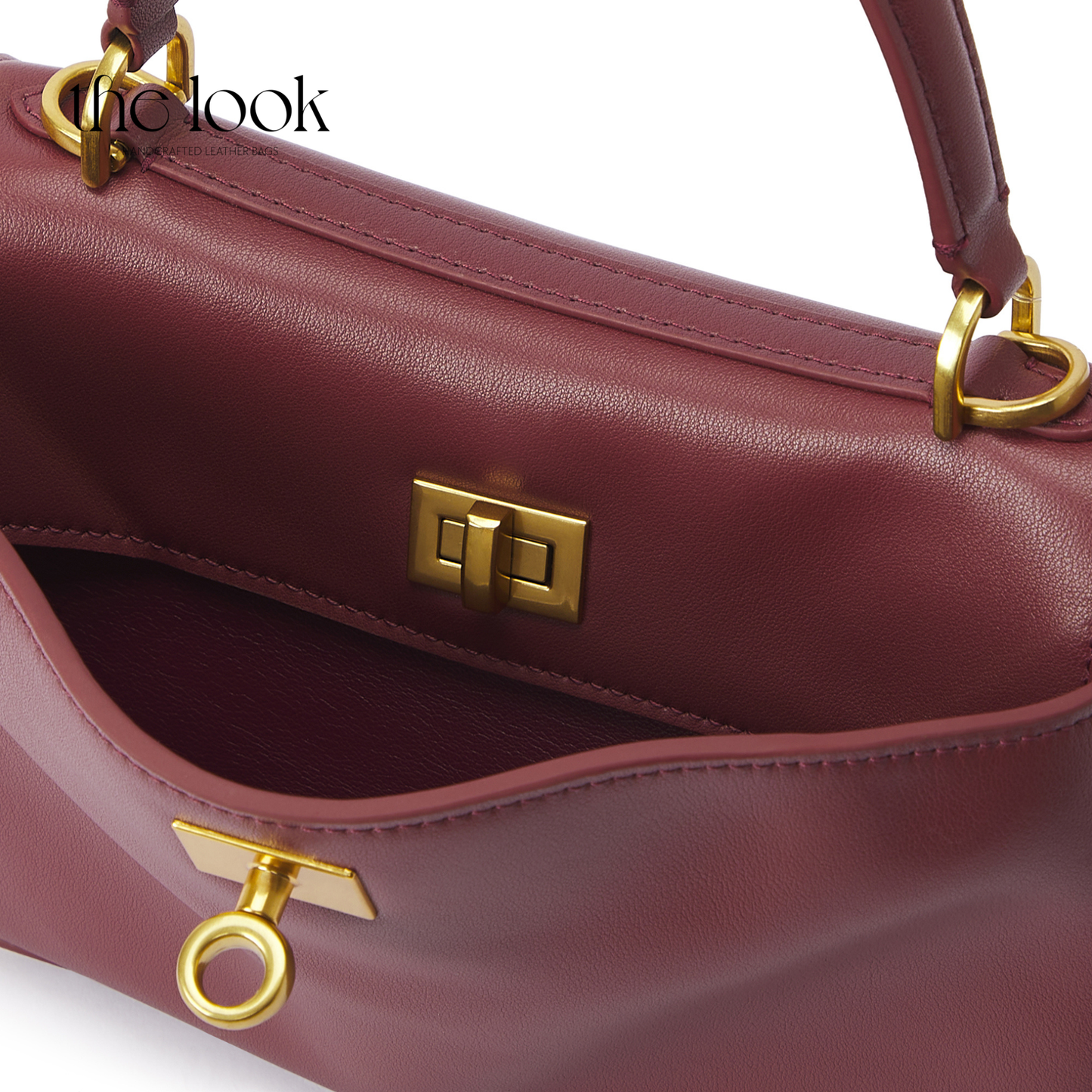 The Valen Small Satchel — genuine leather handbag, third colour held | The Look Officiel