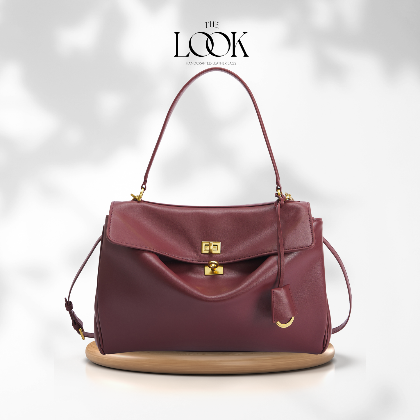 The Valen Large Satchel — genuine leather handbag, front detail | The Look Officiel