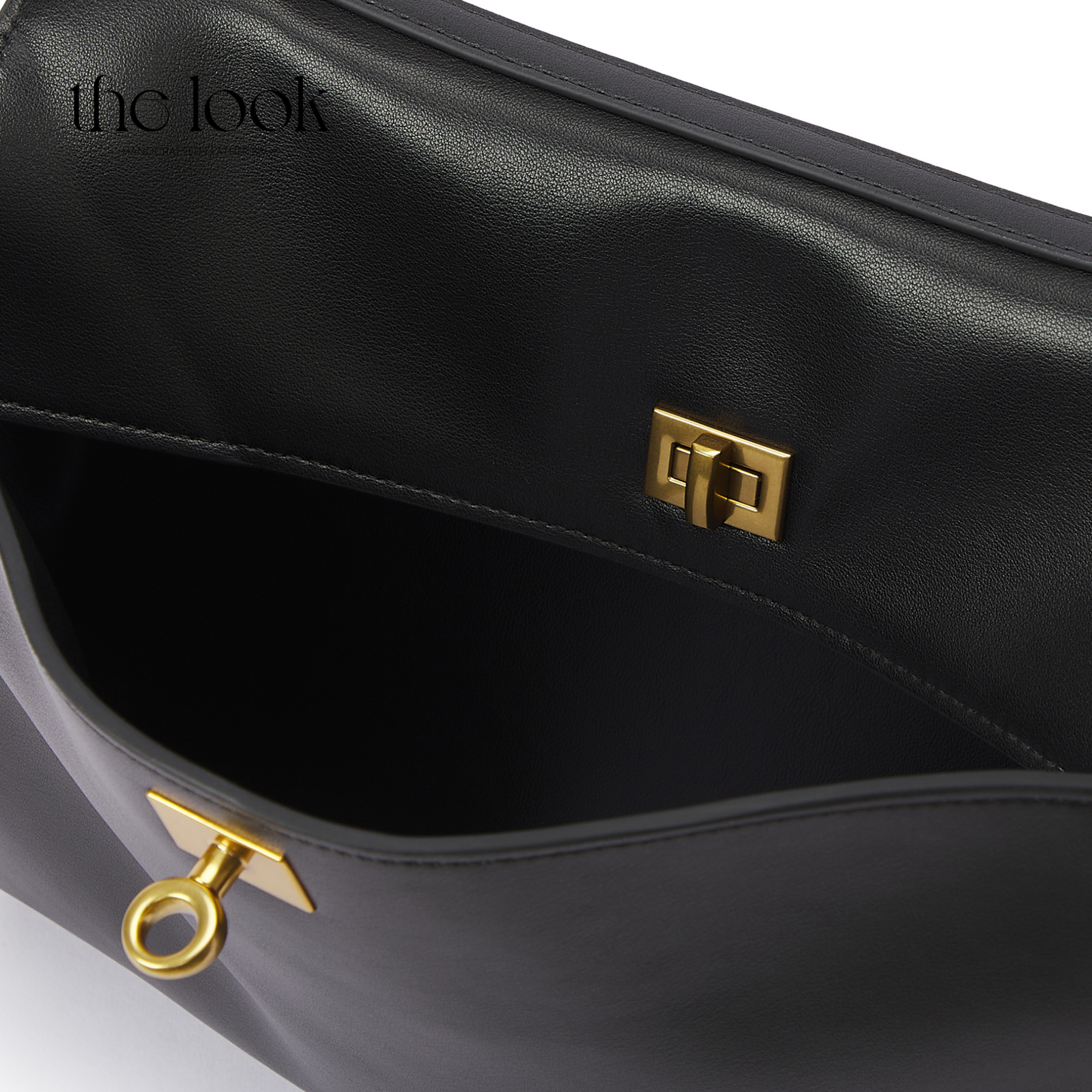 Black handbag with gold accents on a white background